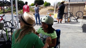 Kira from Bike Smart fits a kid with a helmet